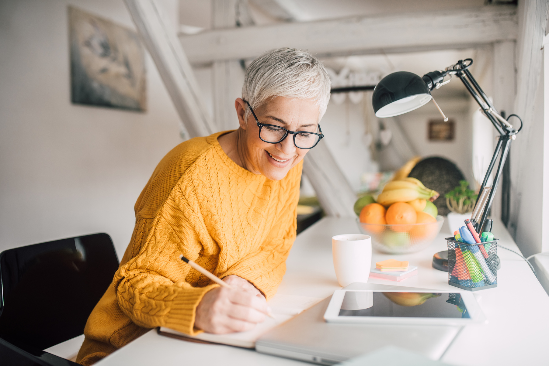 Older woman writing